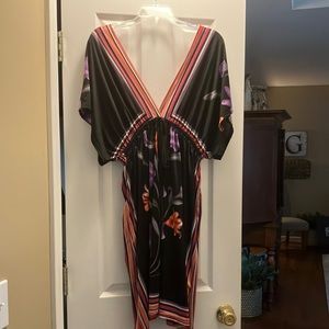 Jersey dress. Fits like a 2X but no size is found in dress.